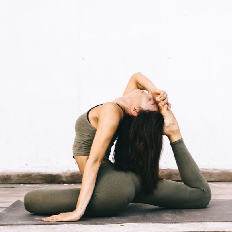 attractive-model-yoga-pose-white-surface-clothes (1) (1)